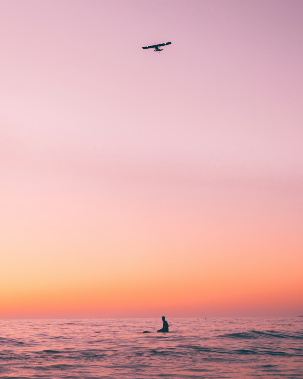 a plane flying over a body of water