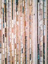 an aerial view of a train yard with many cars