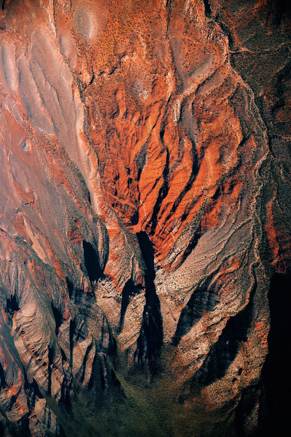 an aerial view of a rocky mountain side