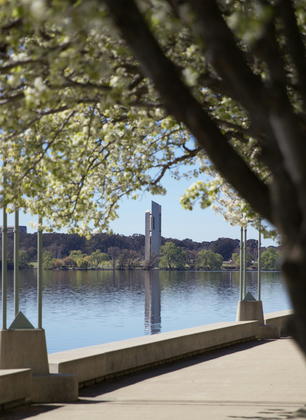 a view of a body of water with a clock tower in the distance