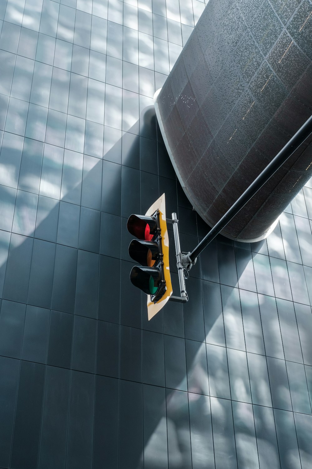 a traffic light sitting on the side of a building