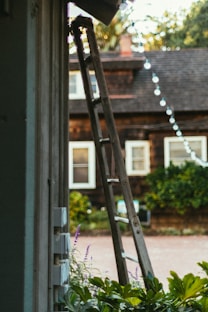 a ladder leaning up against a house