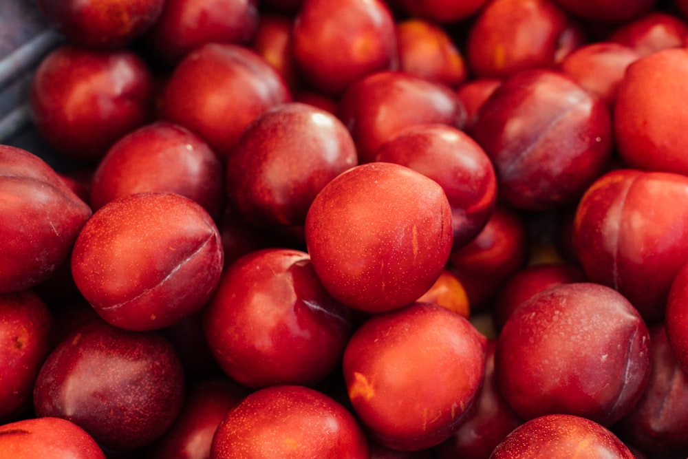 a pile of plums sitting next to each other