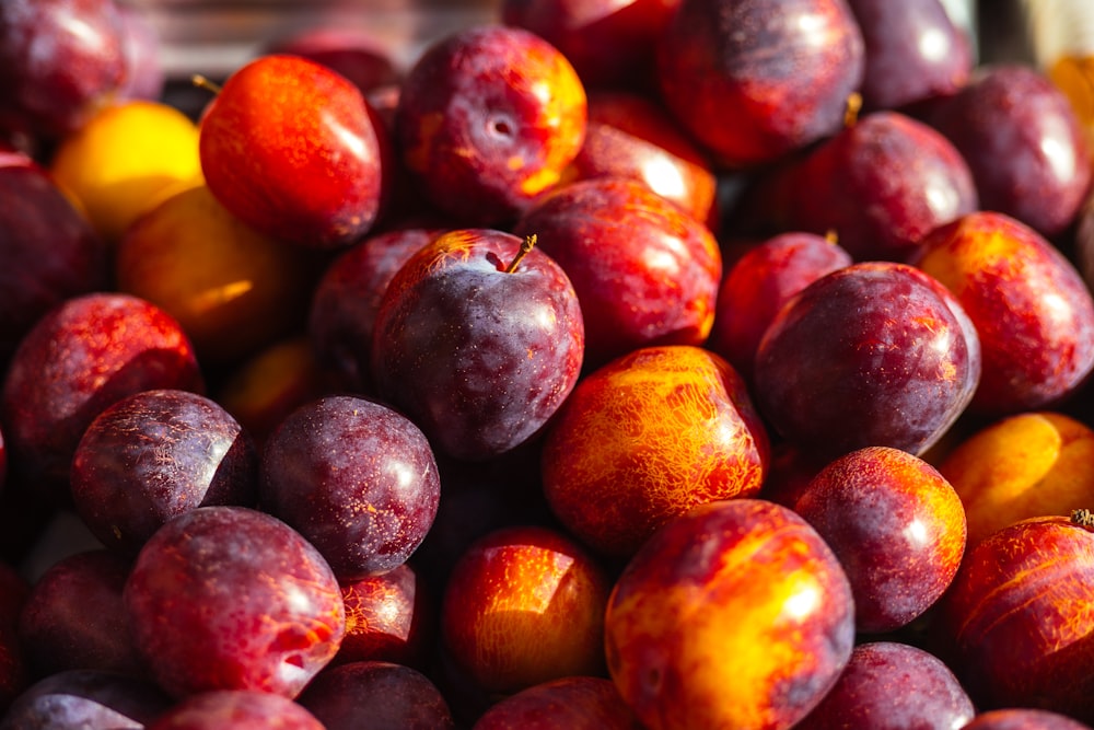 a pile of plums sitting on top of each other