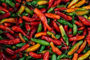 A vibrant display of various Thai chili peppers.