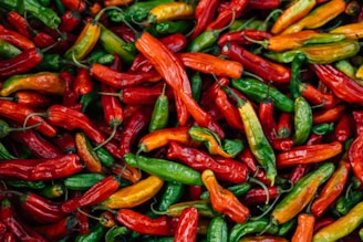 A vibrant display of various Thai chili peppers.