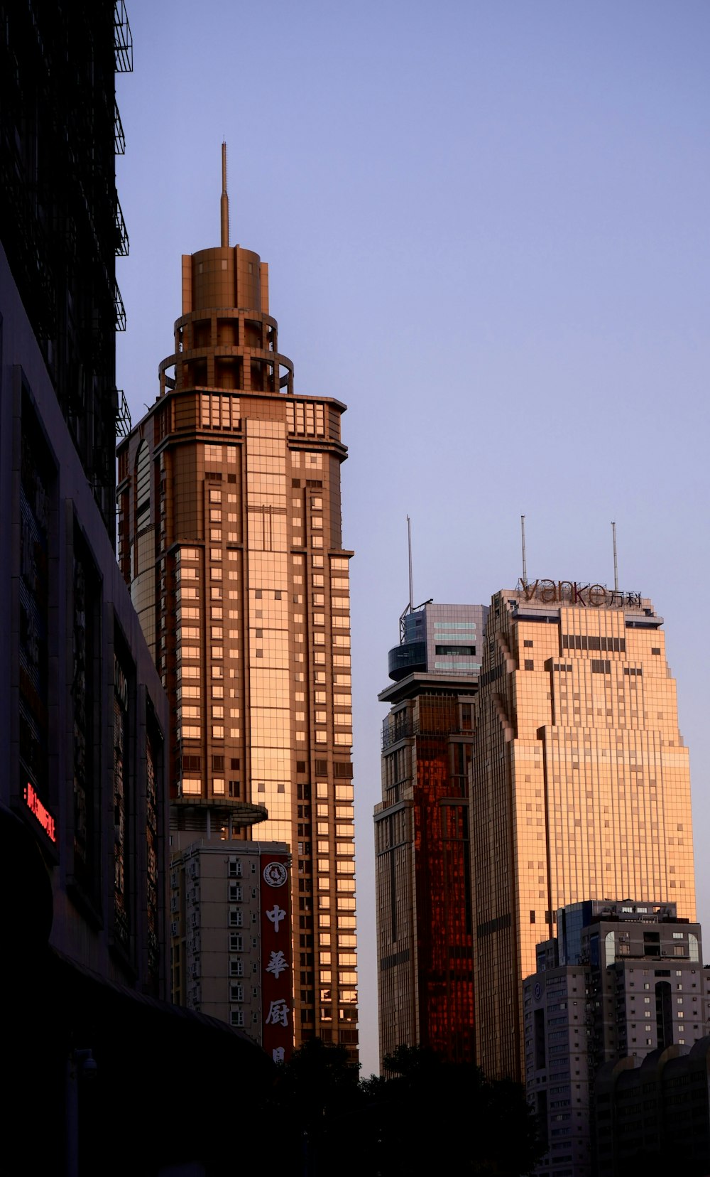 a view of some very tall buildings in a city