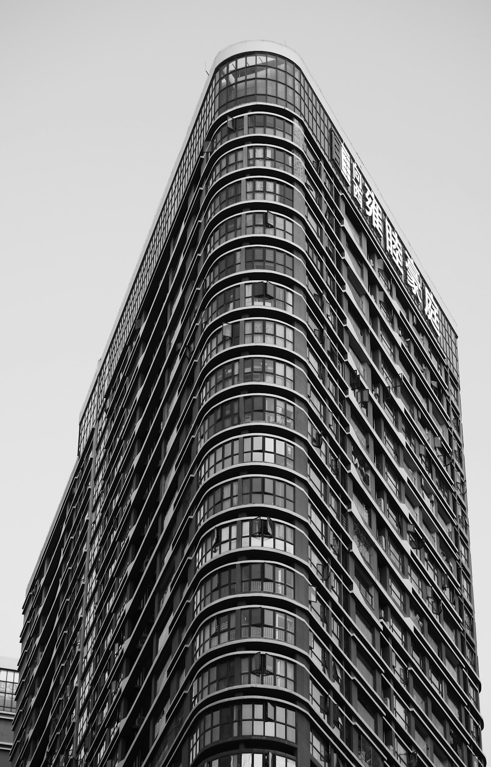 a black and white photo of a tall building