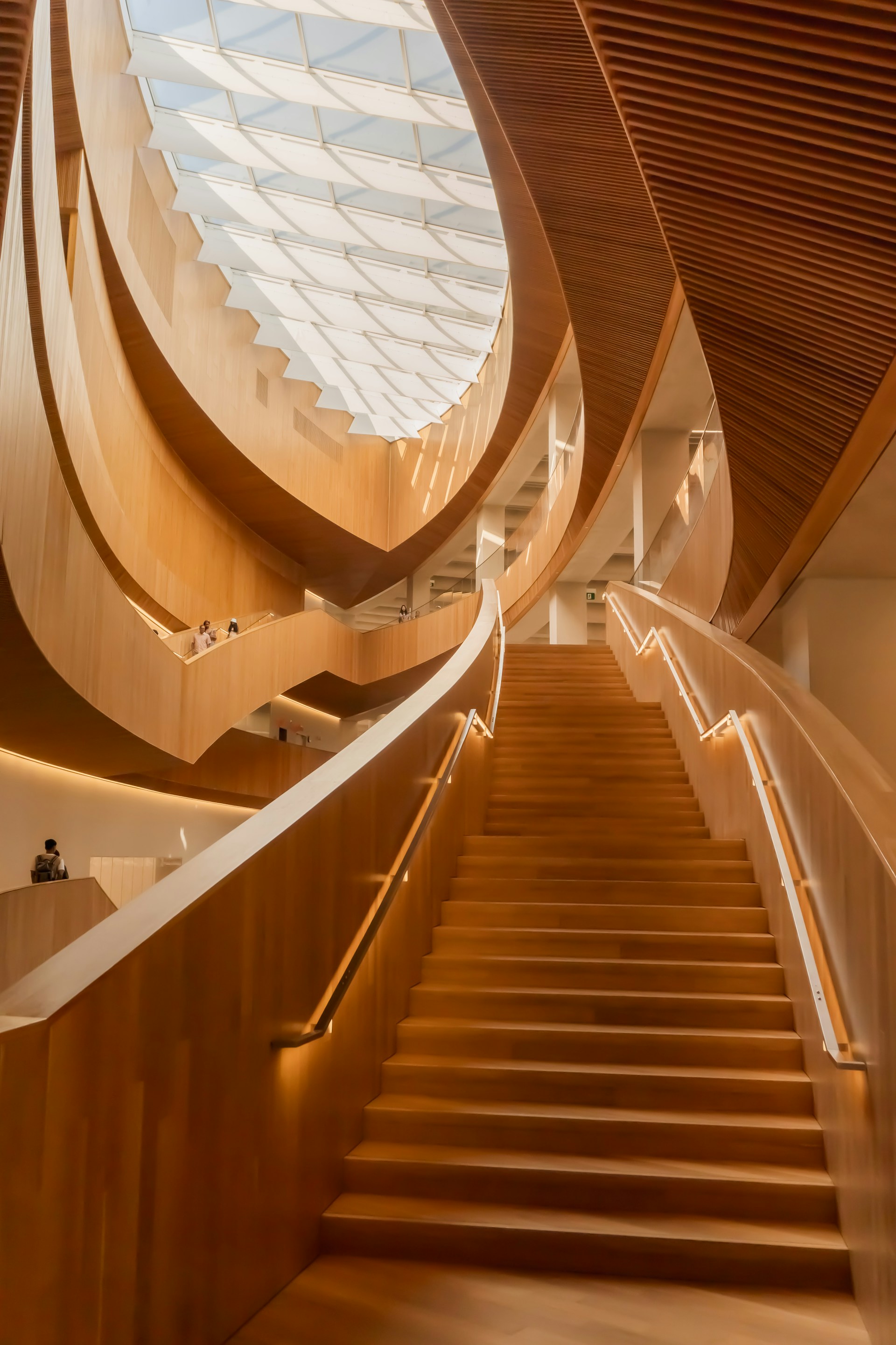 woman wearing yellow long-sleeved dress under white clouds and blue sky during daytime