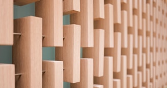 A warm wooden texture background with modular interlocking wooden blocks assembled neatly.