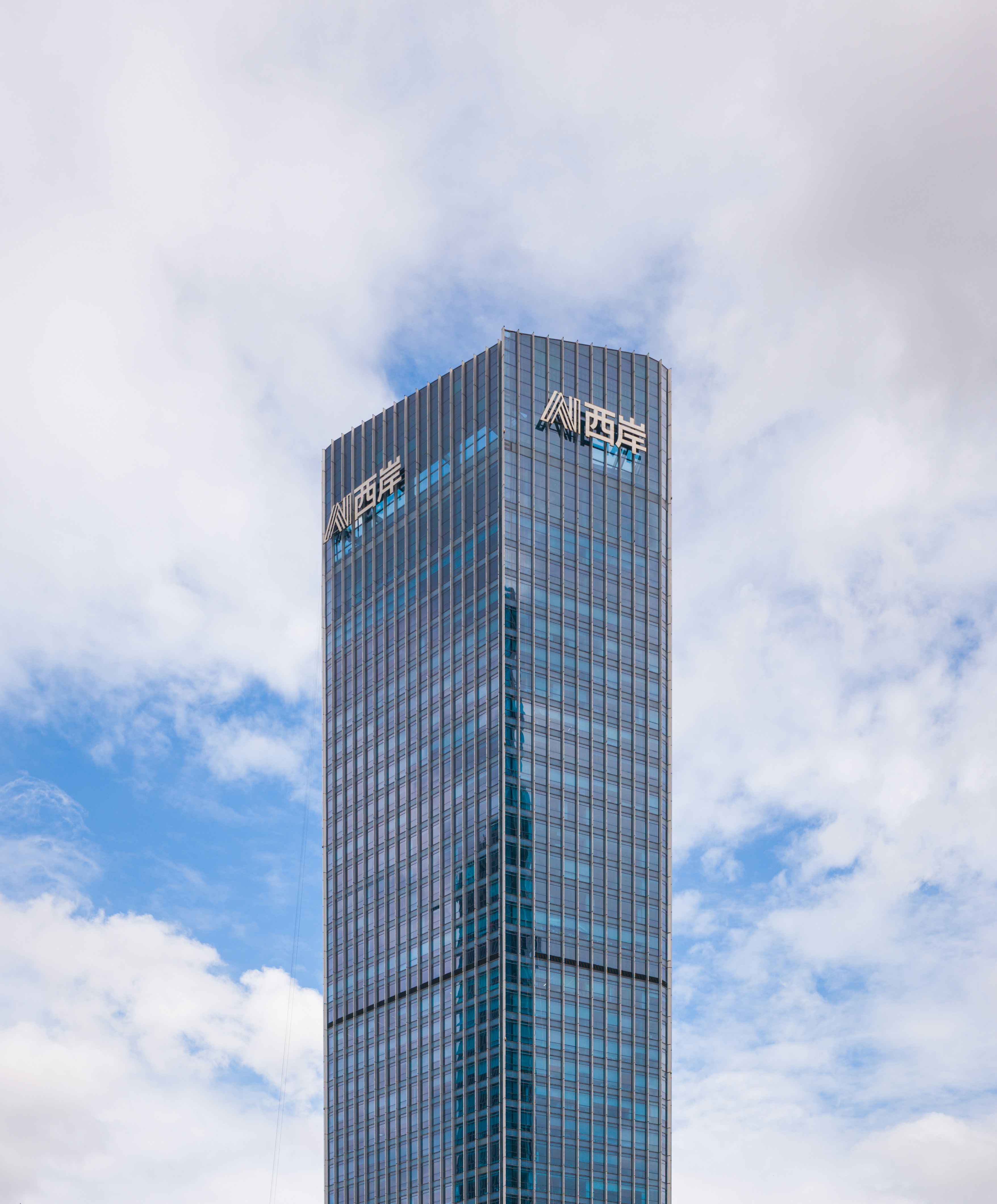 a very tall building with a sky background