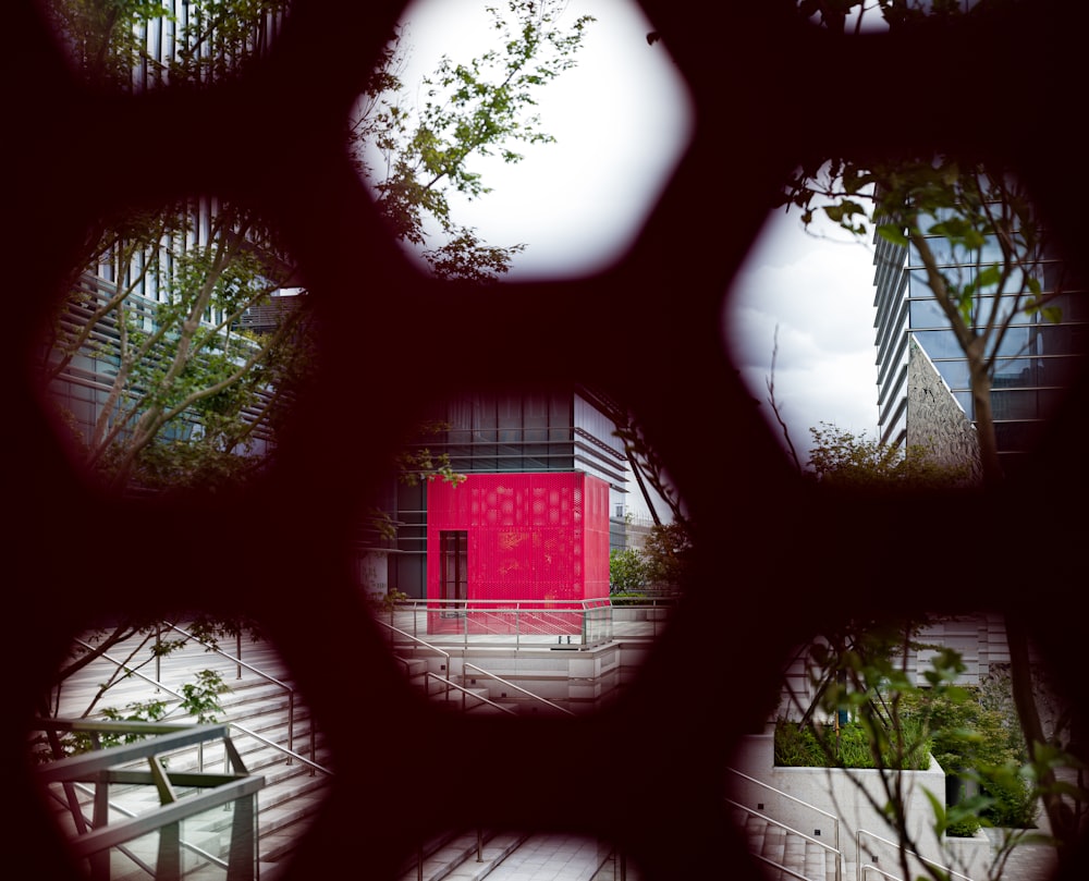 a view of a building through a circular window