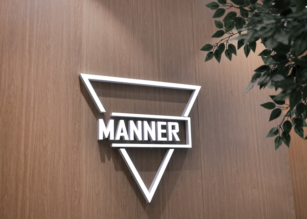 a wooden wall with a sign that reads manner manner manner manner manner manner manner manner