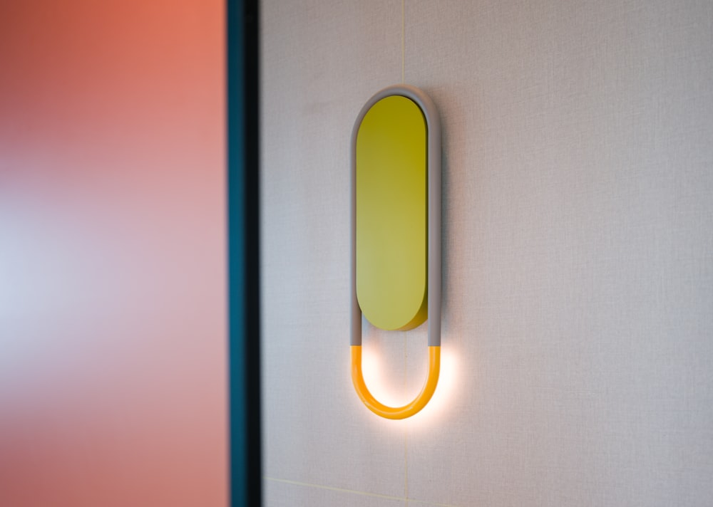 a yellow object is mounted on a wall