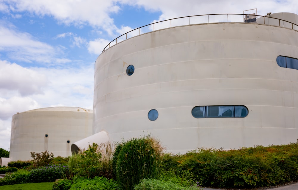 a large white building with round windows on top of it