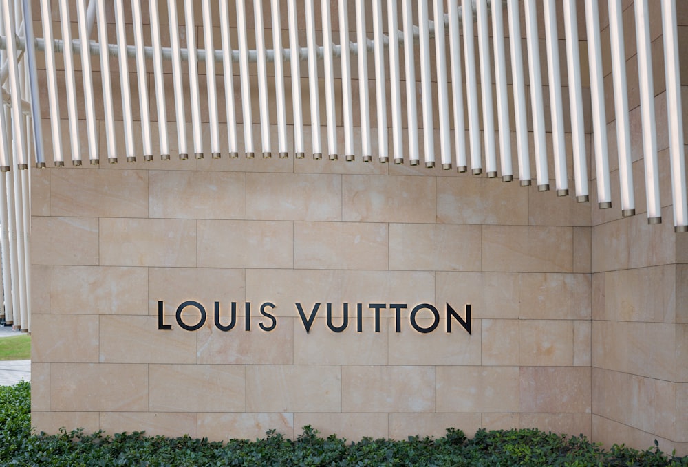 a sign on the side of a building that says louis vutton