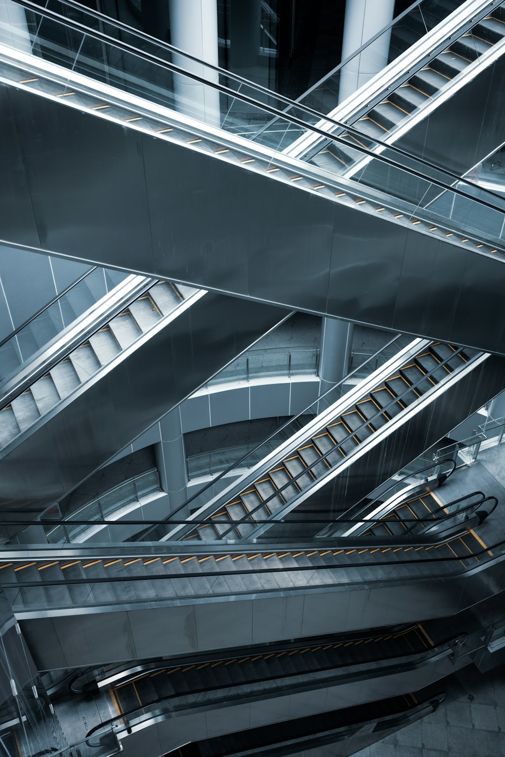 an overhead view of an escalator in a building