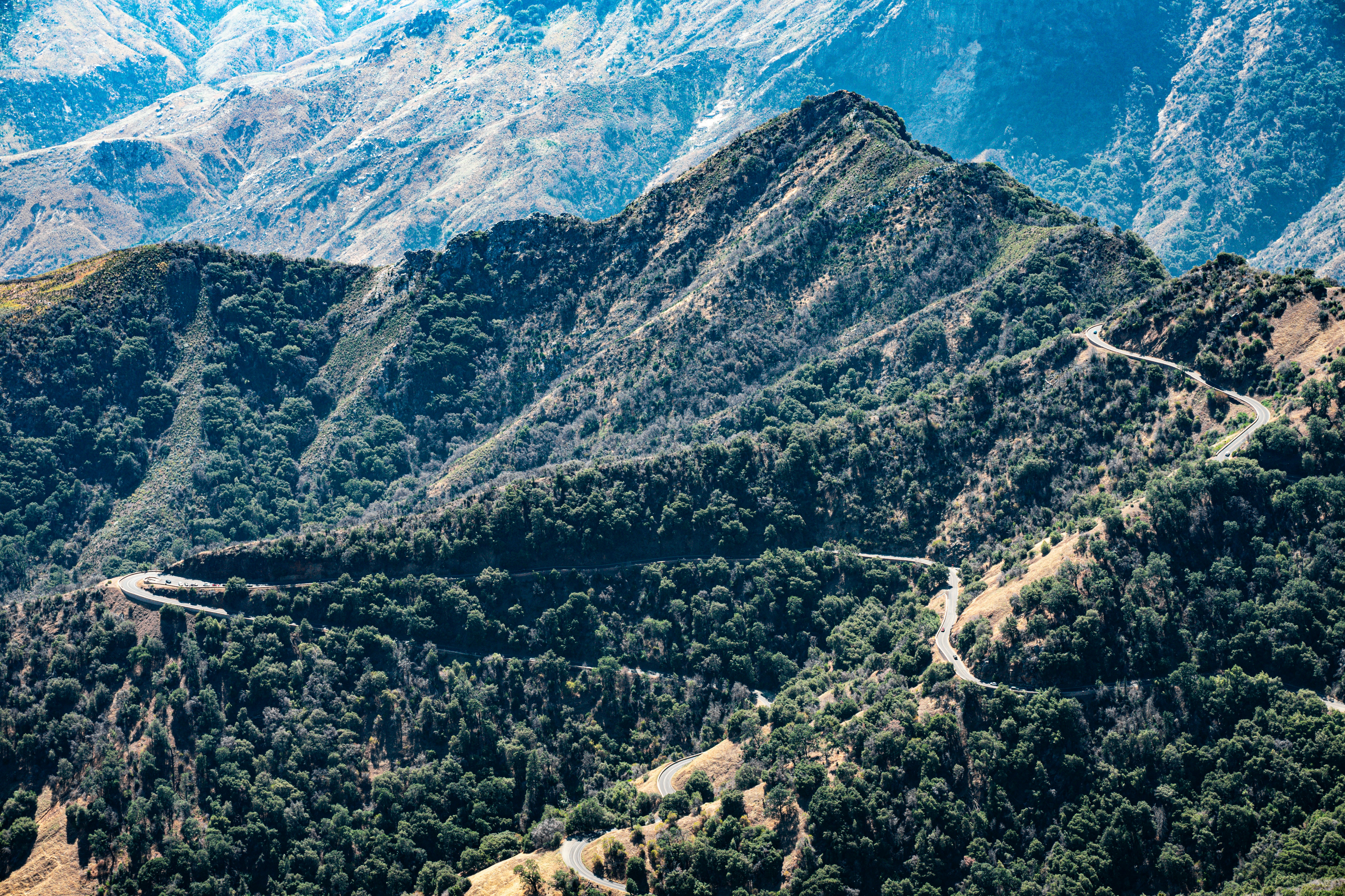 Mountainous terrain in Malibu, California, with a winding road - sophia hutchins
