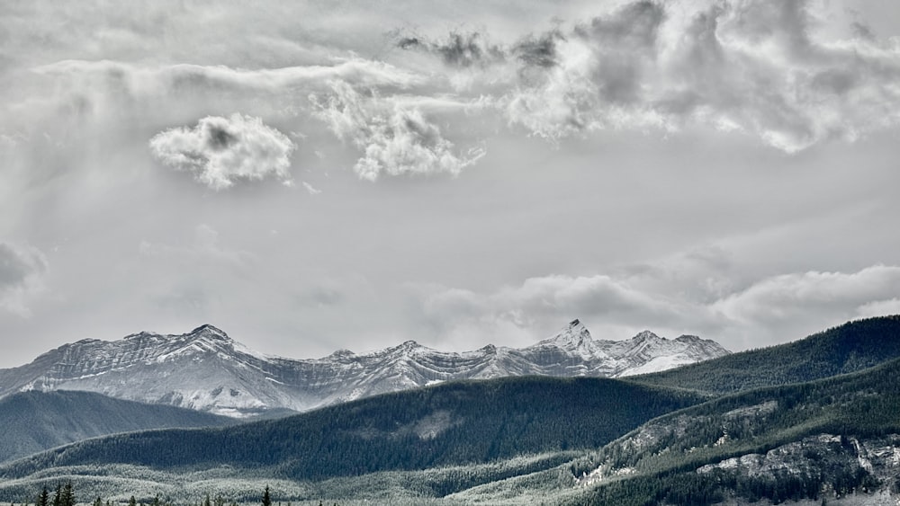 a black and white photo of a mountain range