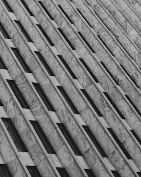 Precision-cut marble pieces arranged for a large-scale architectural installation.