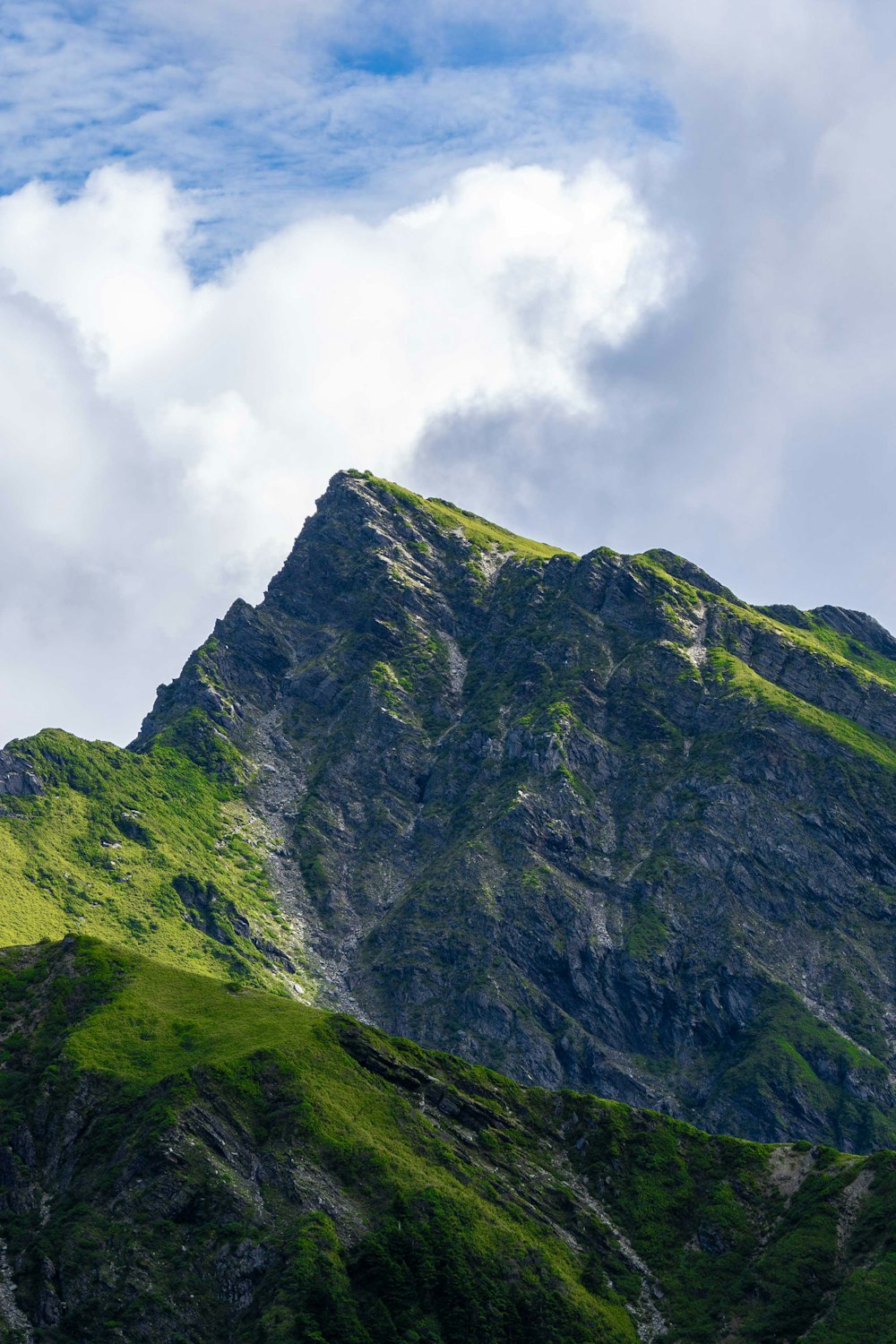 a very tall mountain with a sky background