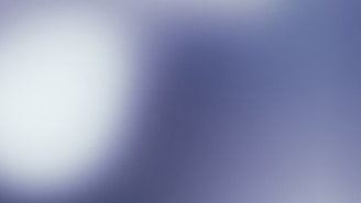 Abstract modern background with soft blue and white tones representing professional growth.