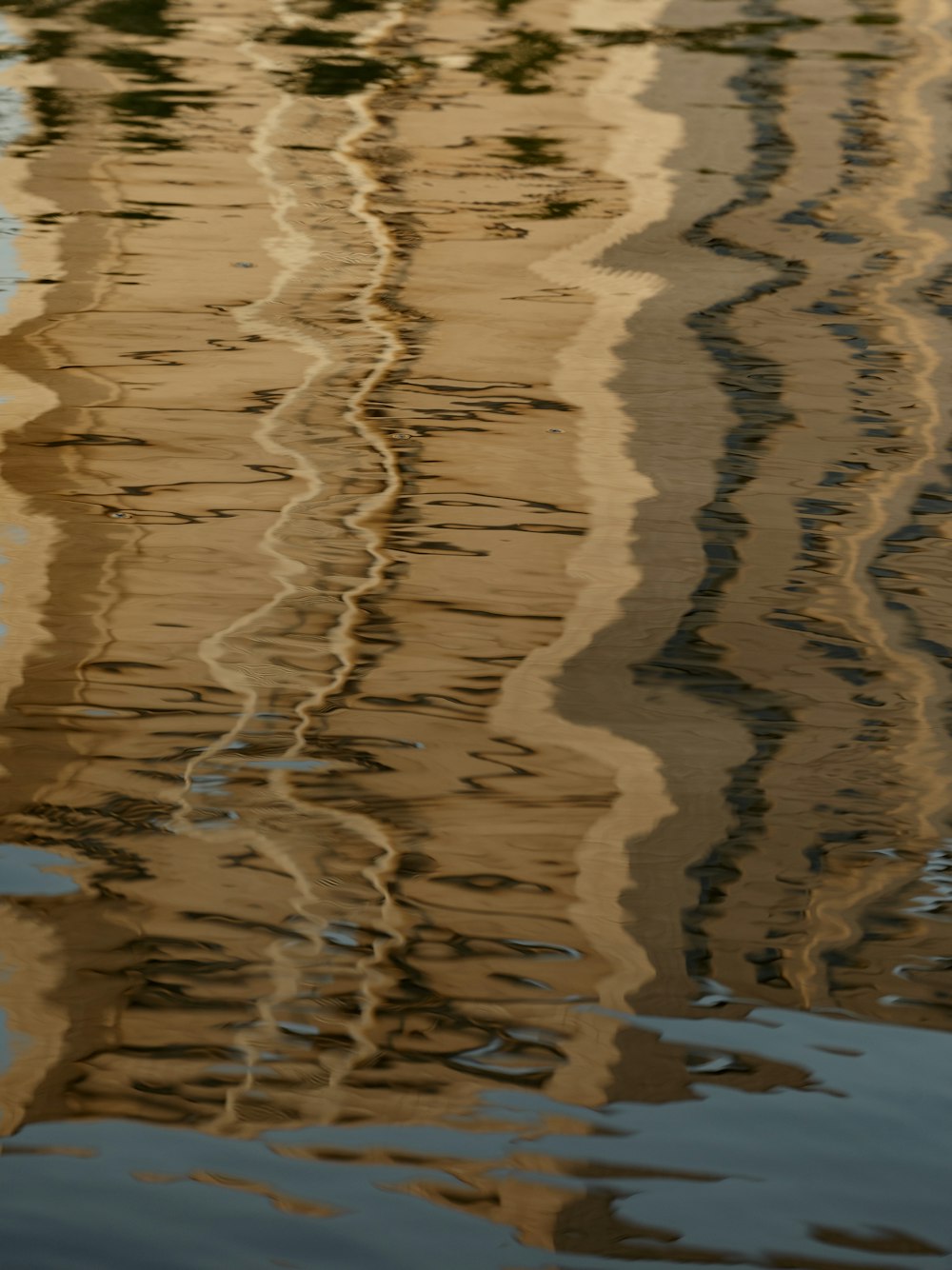 the reflection of a boat in the water