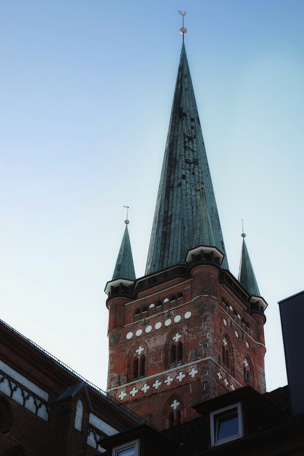 a church steeple with a cross on the top