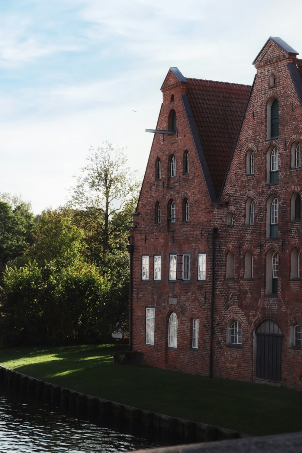 a large brick building with a clock on the front of it