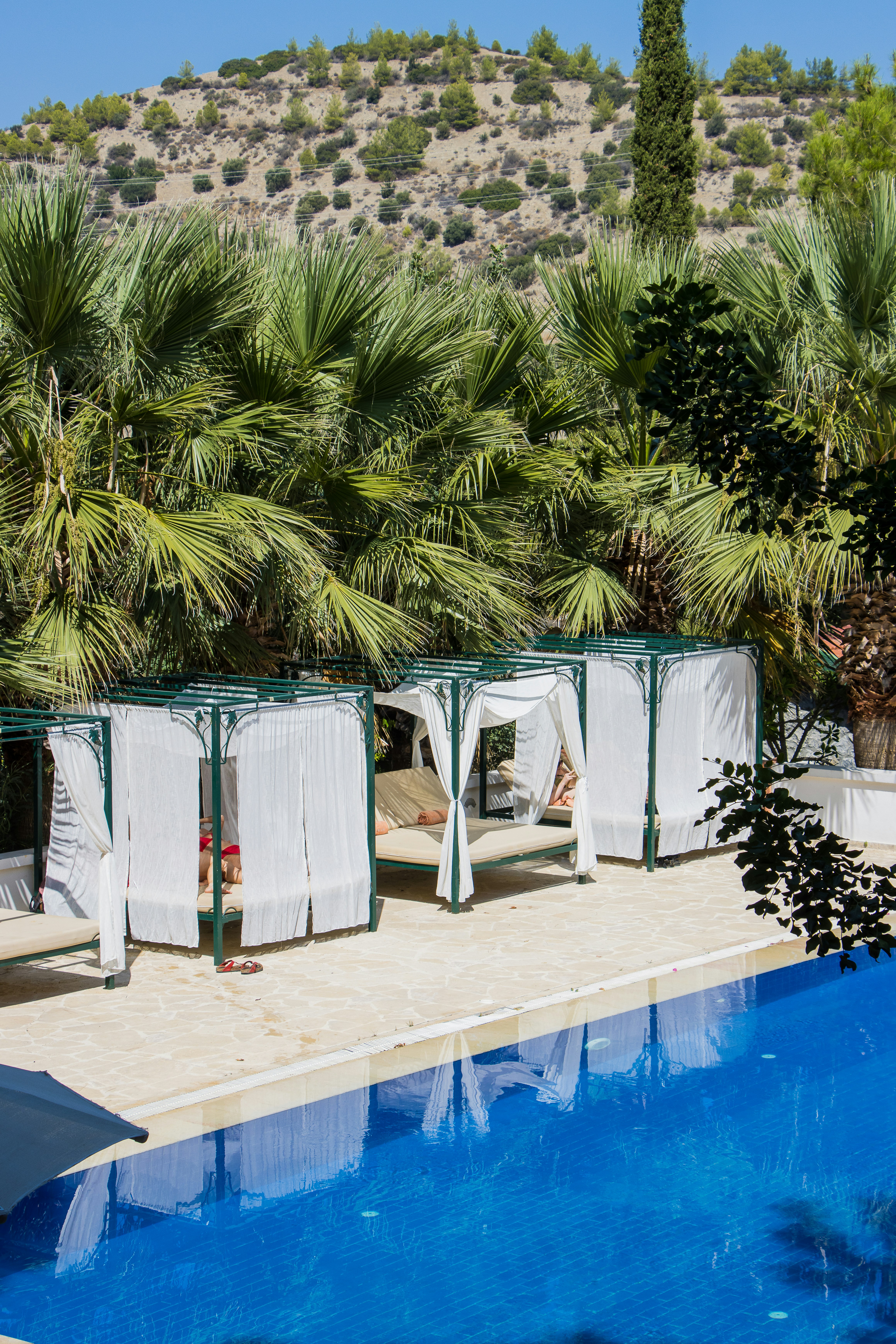 a swimming pool with a bunch of towels hanging over it