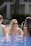 a group of women sitting in a swimming pool