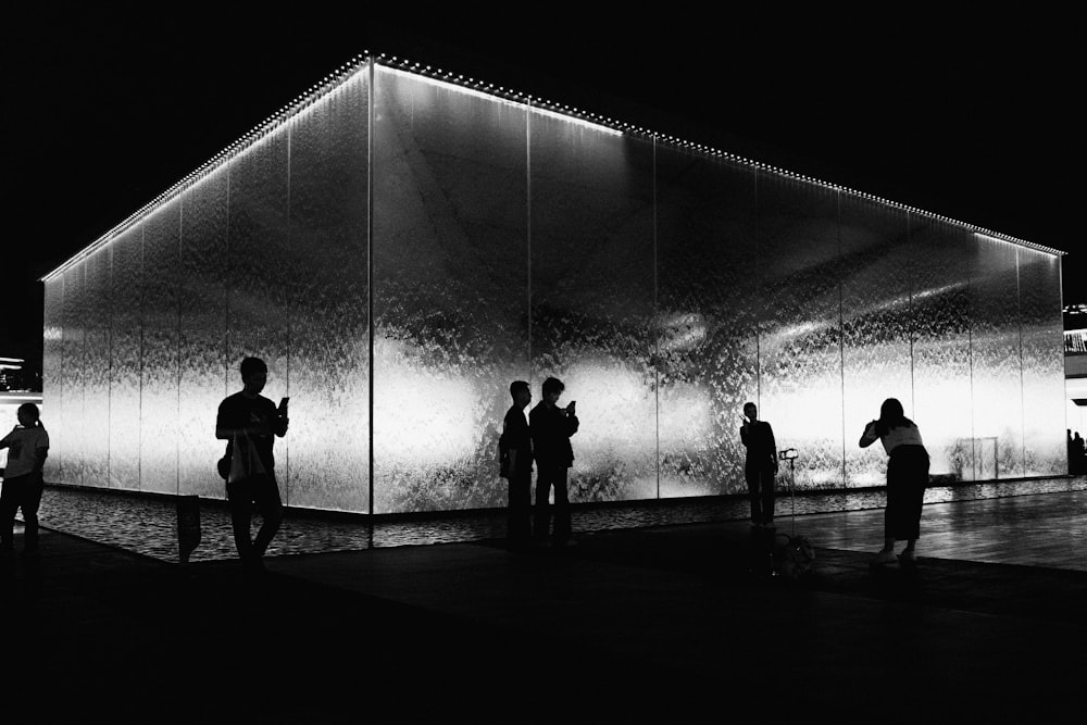 a group of people standing in front of a building