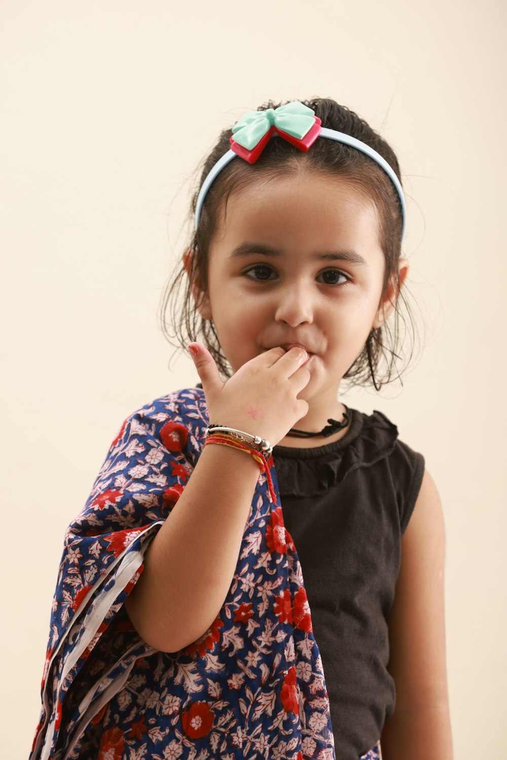 a little girl with a big bow on her head