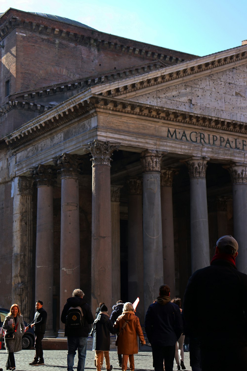 a group of people standing in front of a building