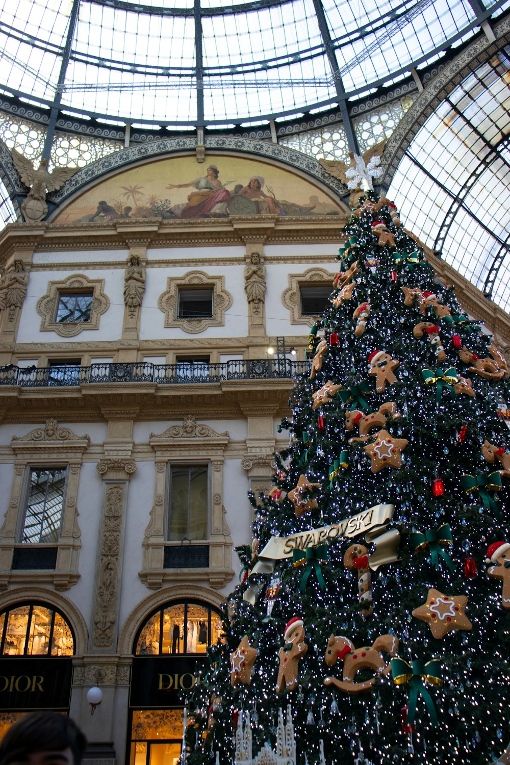 a christmas tree inside of a large building