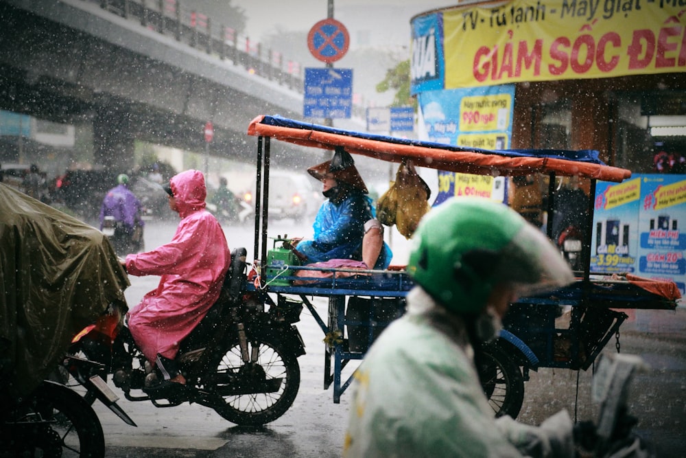 a group of people riding on the back of a motorcycle