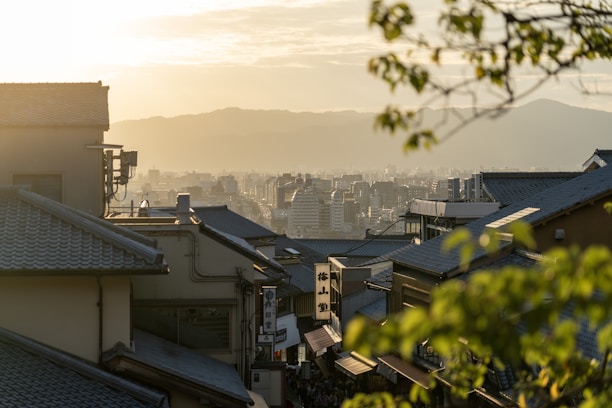 A vibrant collage showing Kyoto’s temples, Osaka’s cityscape, and Kobe’s harbor at sunset.