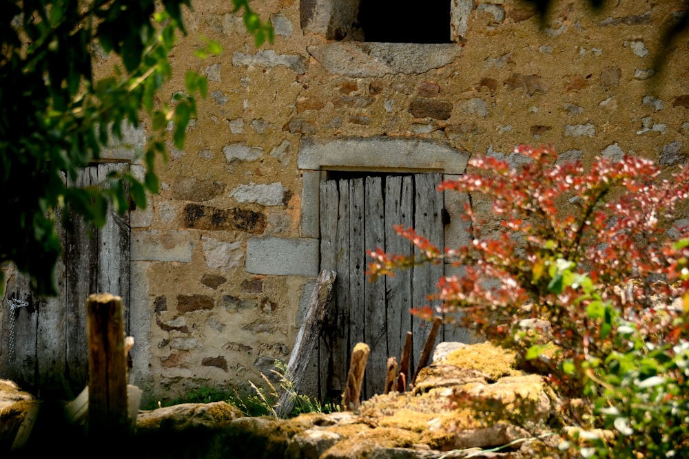 an old stone building with a wooden door