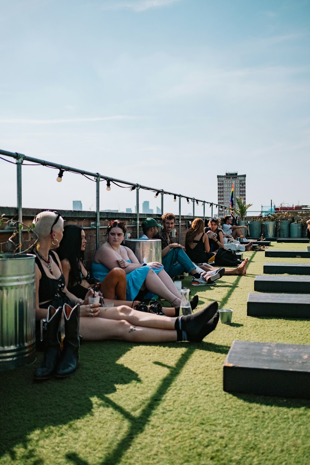 a group of people sitting on top of a roof