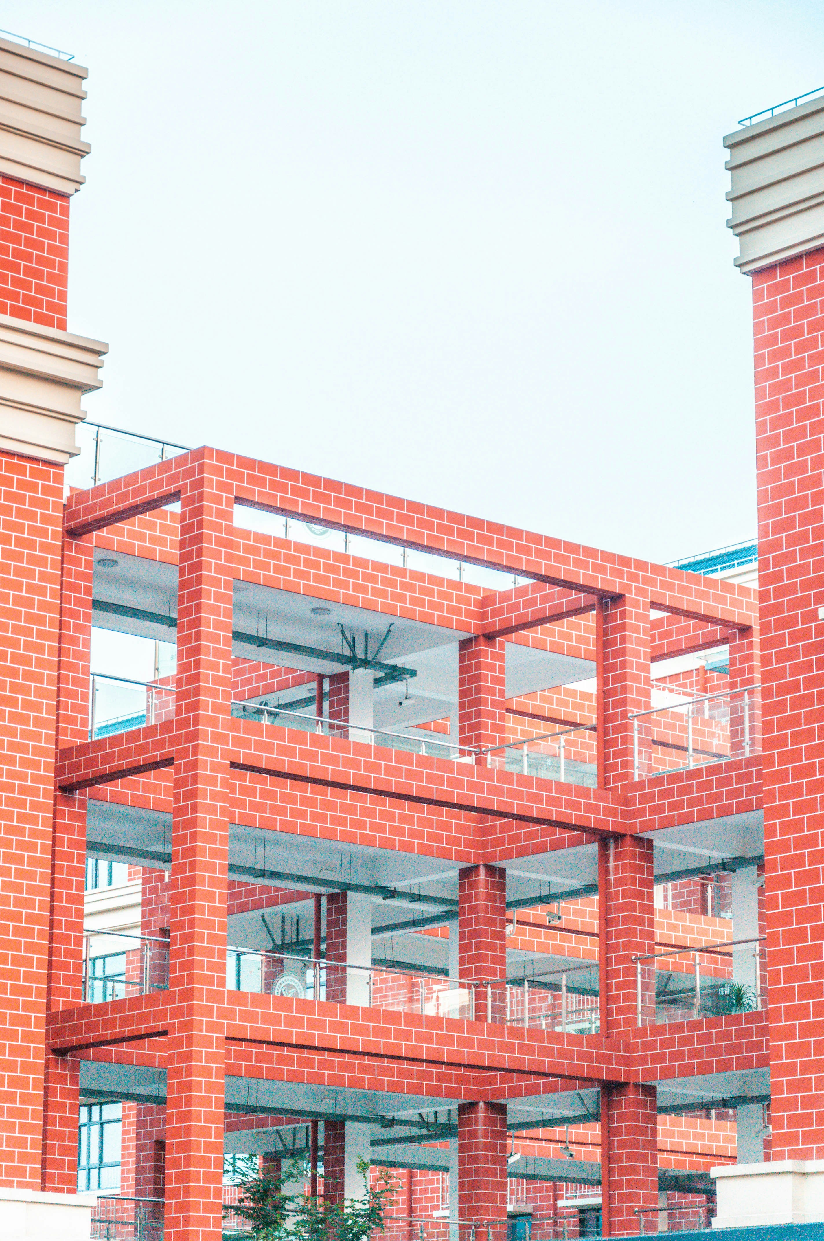A red brick building with a clock on the top of it photo – Free City ...