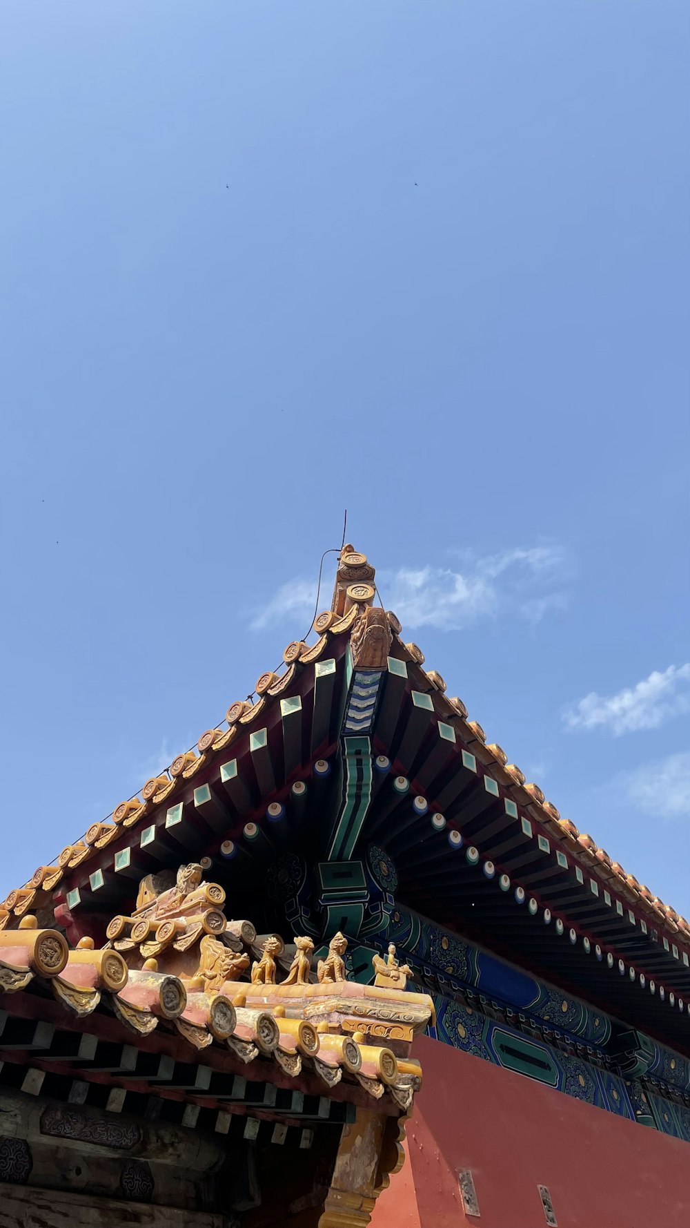 the roof of a building with a blue sky in the background