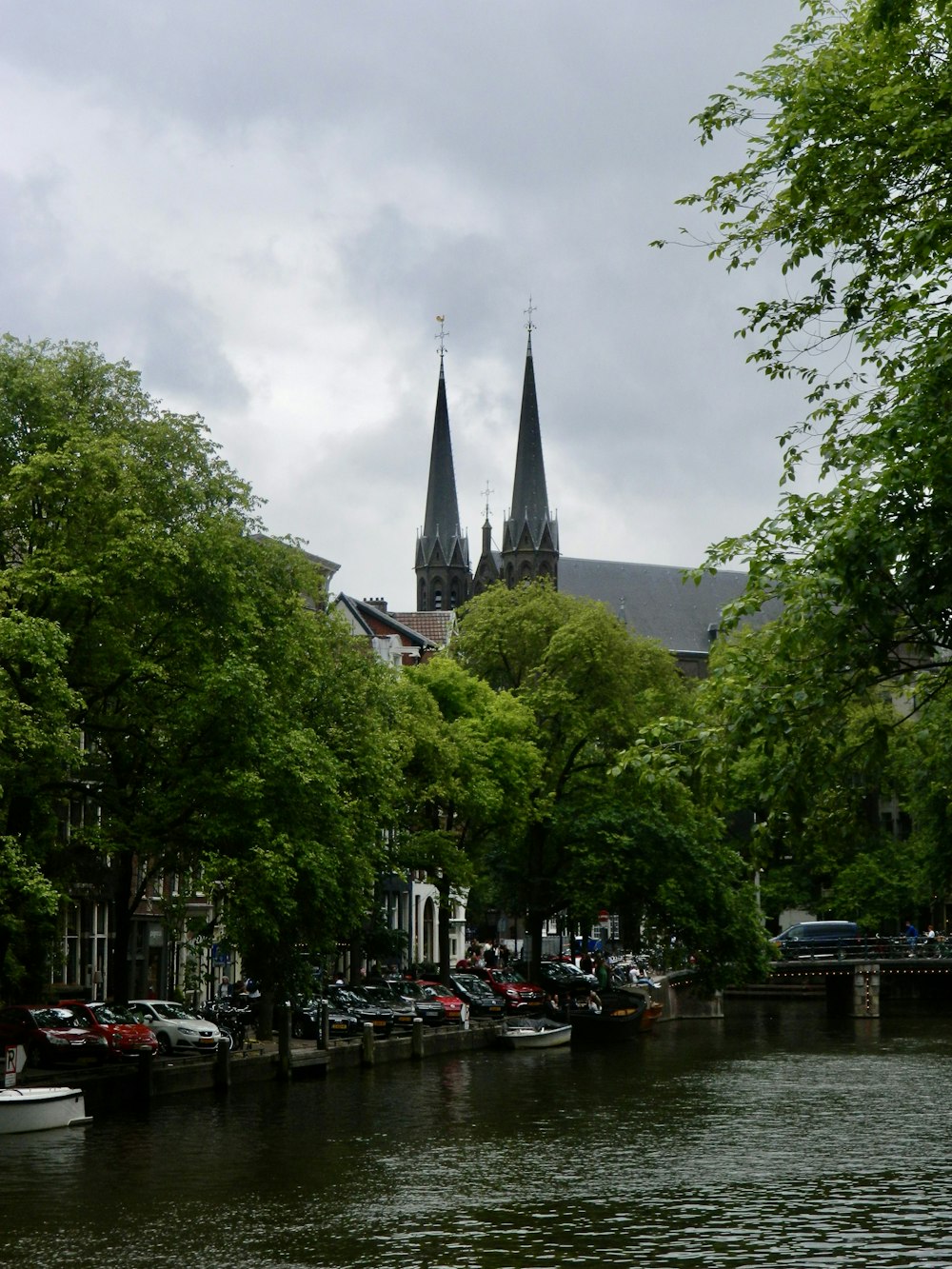 a river running through a city next to tall buildings