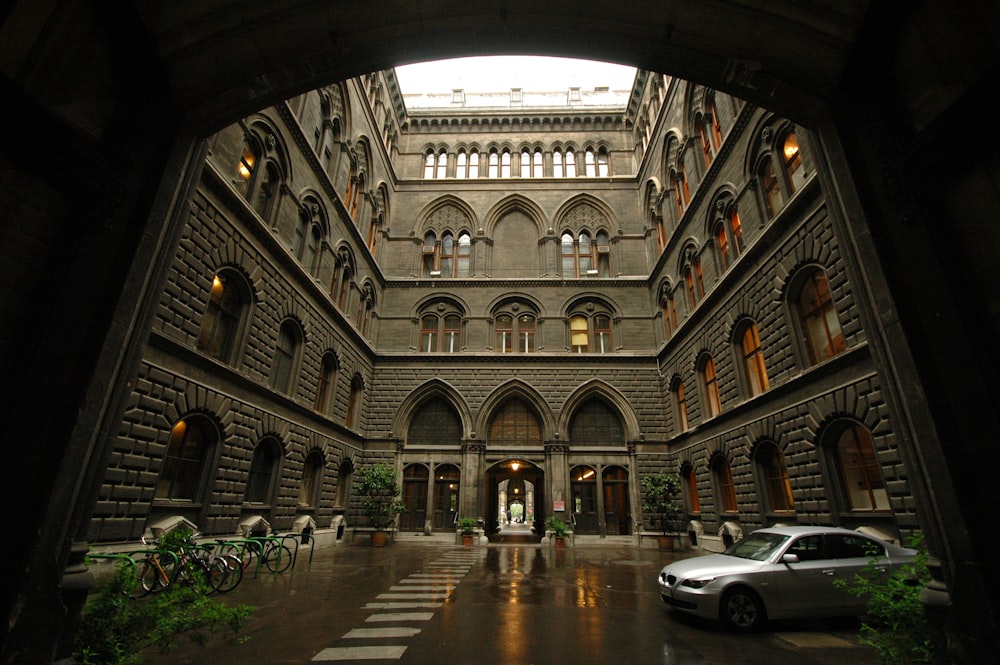 a car is parked in a large building