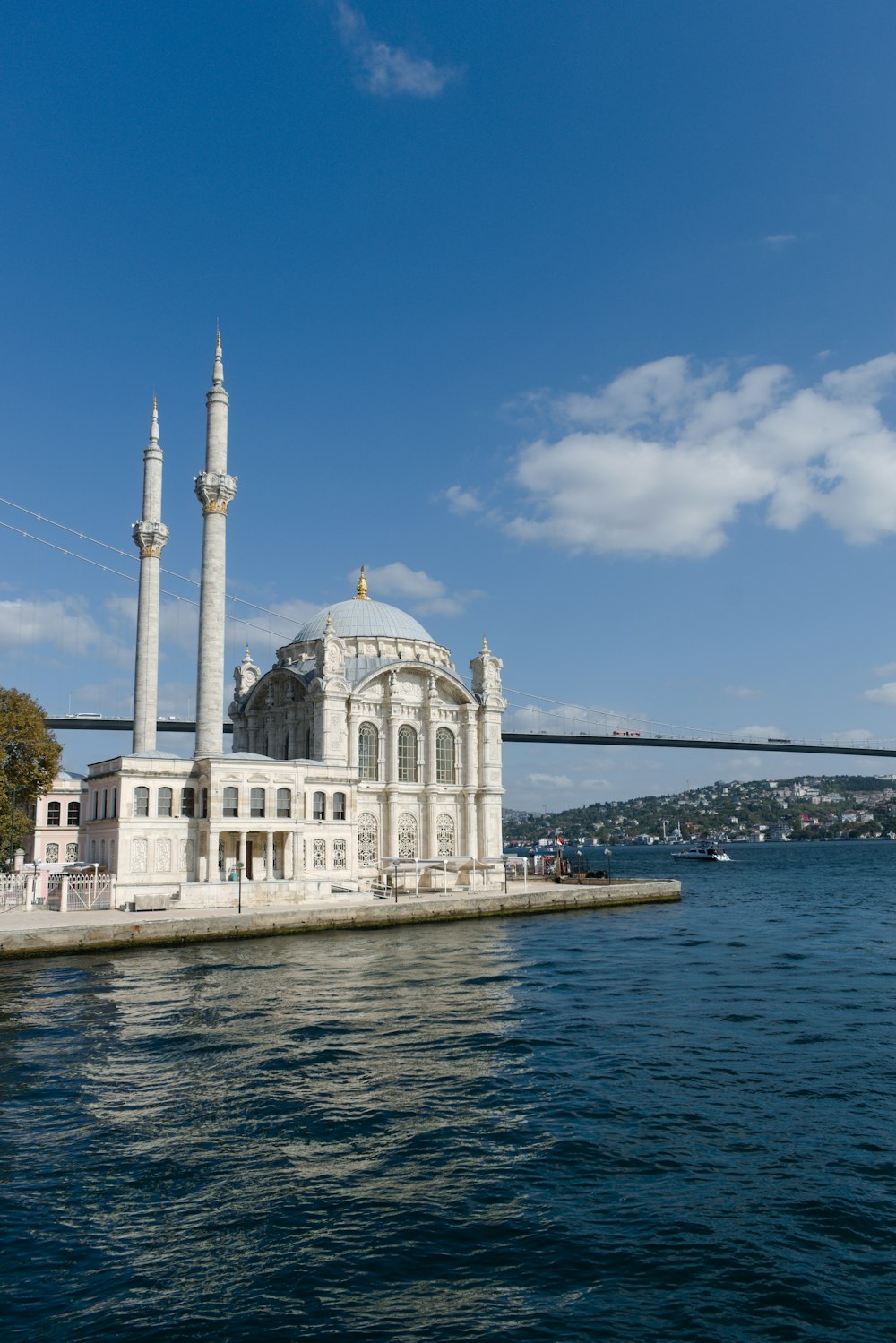 a large white building sitting on top of a body of water