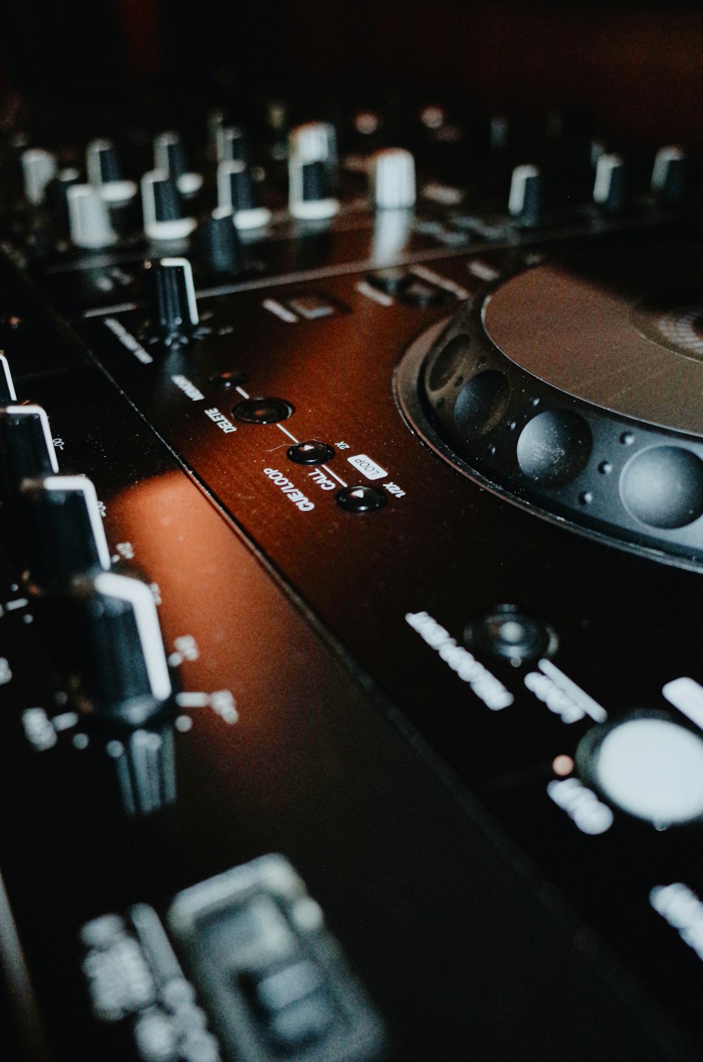 a close up of a dj mixing console