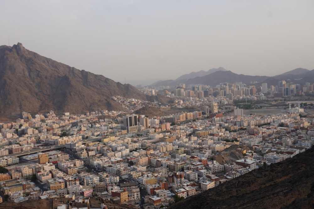 a view of a city with mountains in the background