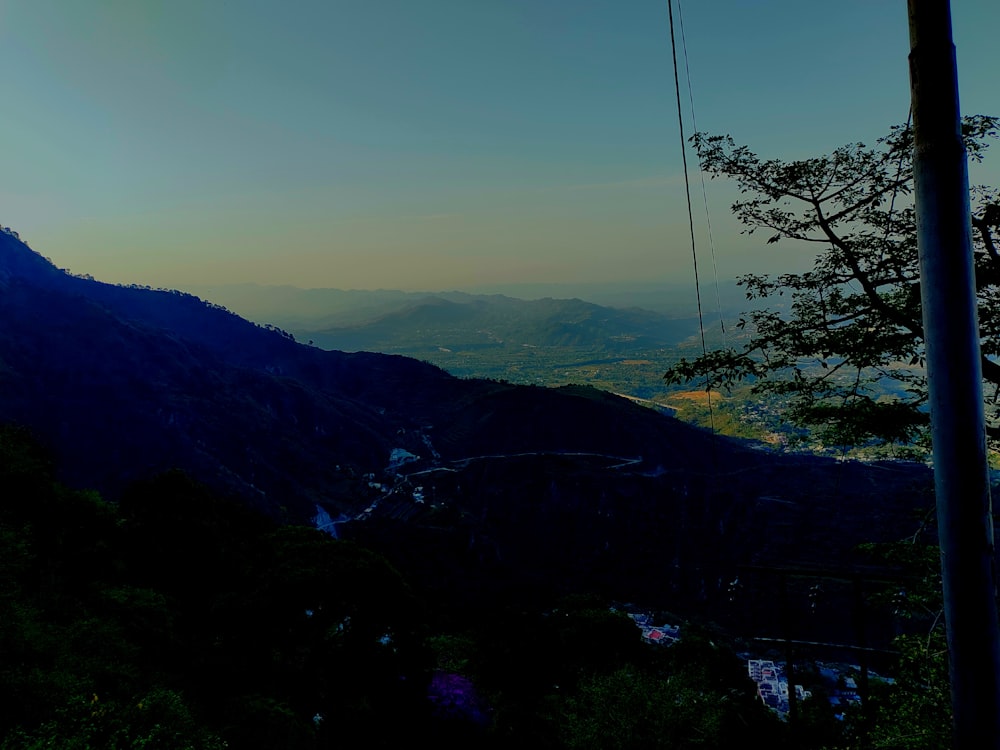 a view of the mountains from a hill top