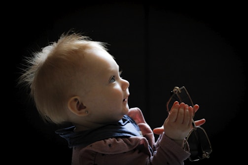 A child receiving glasses for the first time.