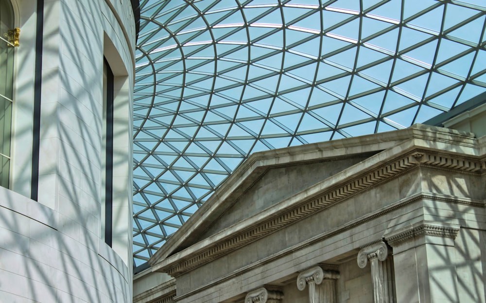 a building with a glass roof and a clock