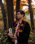 a young man dressed in a harry potter costume